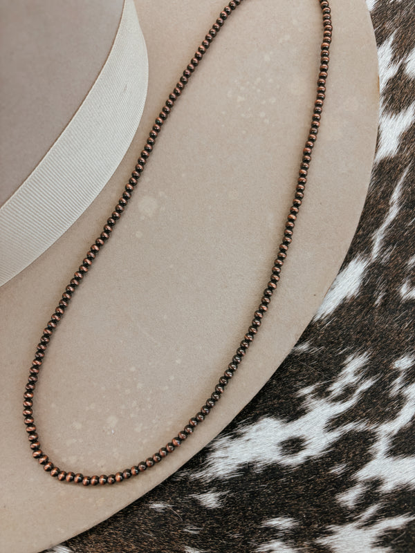 The 20" Faux Bronze Navajo Pearls