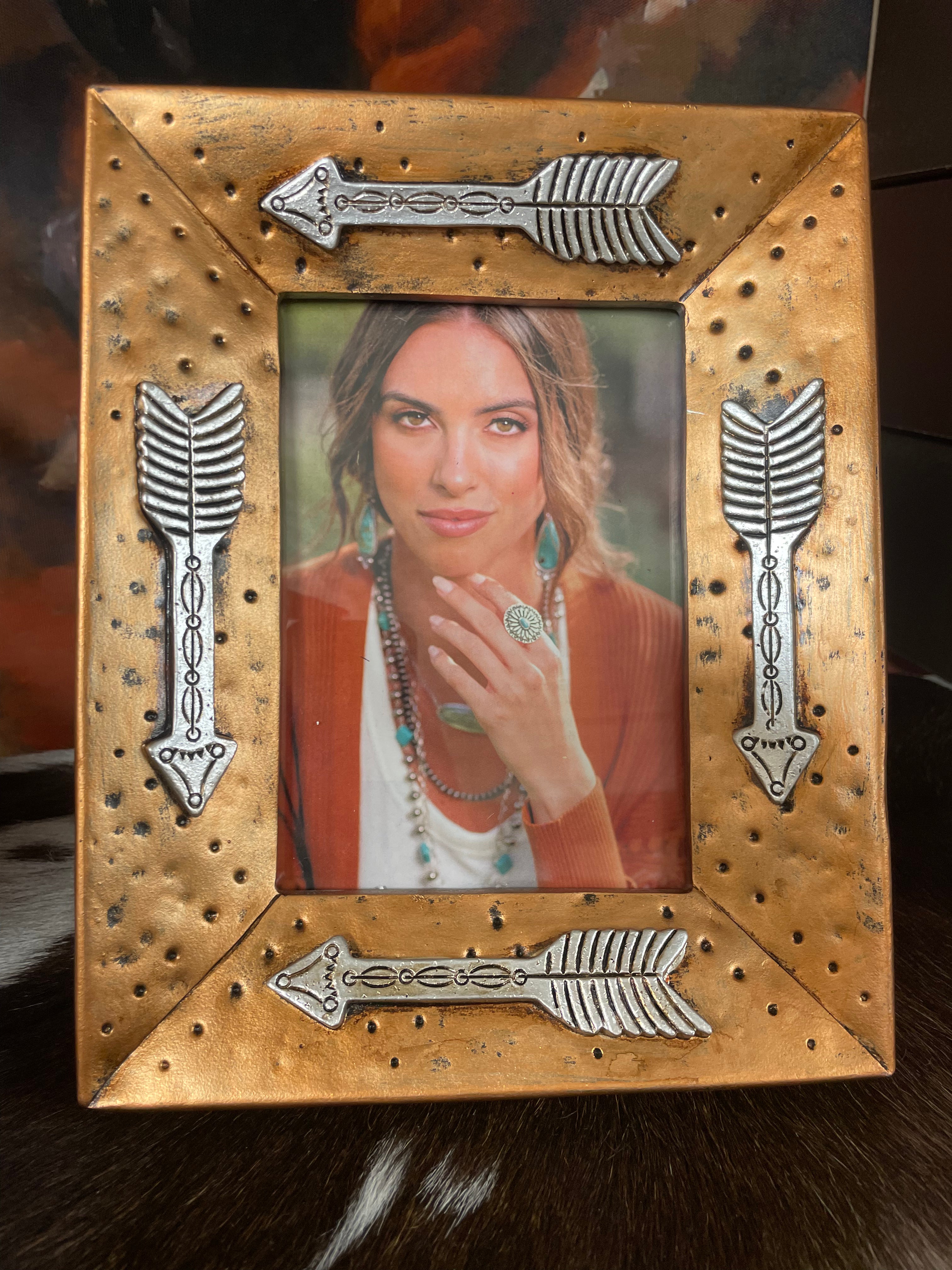 The Gold Picture Frame With Arrows