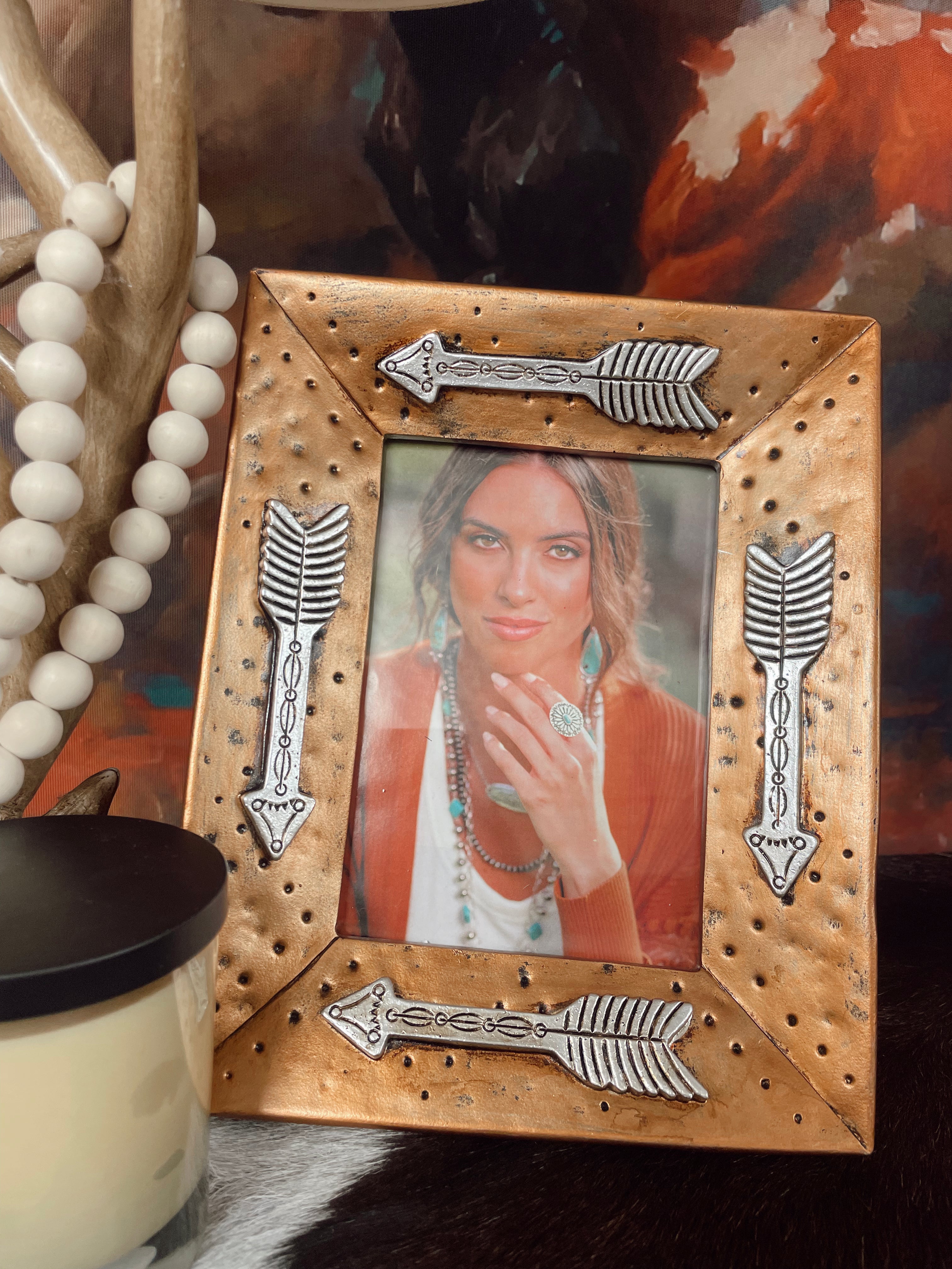 The Gold Picture Frame With Arrows